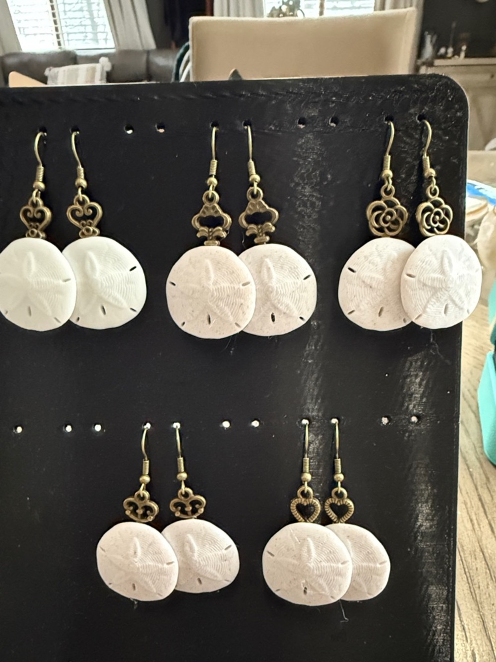 2- pair of small sand dollar earrings with red copper key earring backings